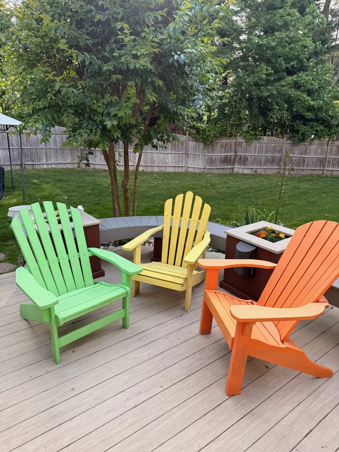 Gray deck with Adirondack chairs after washing