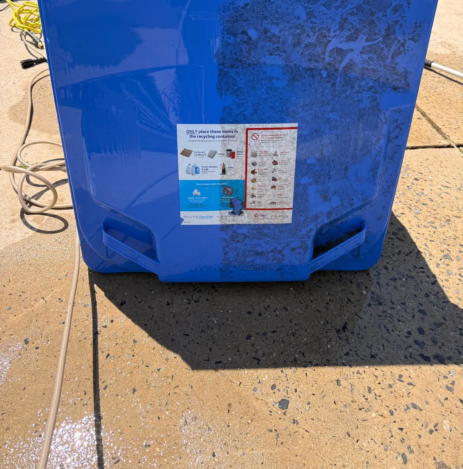 Trash bin half washed: clean on the left, untouched on the right