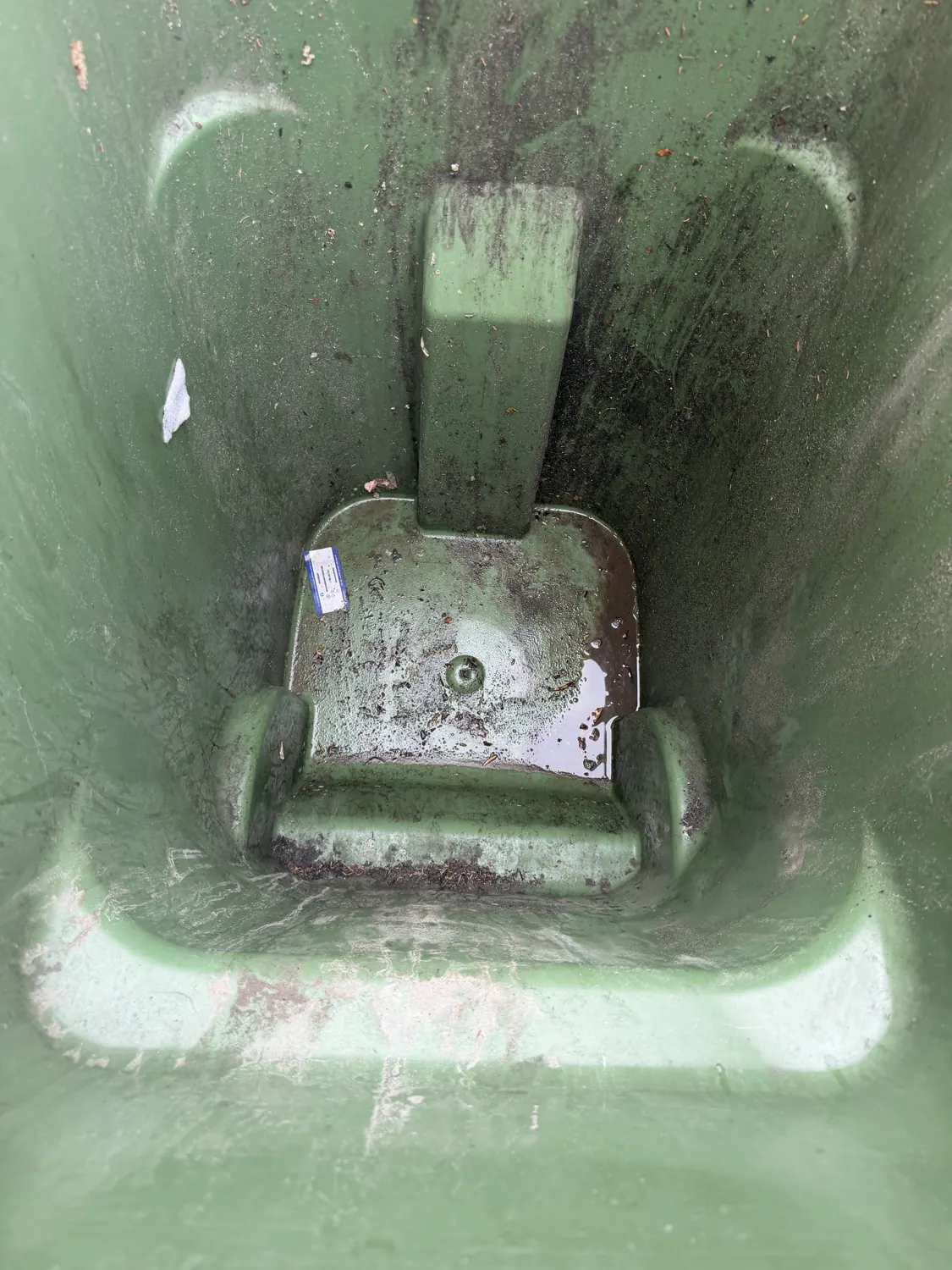 Dirty bin interior before cleaning