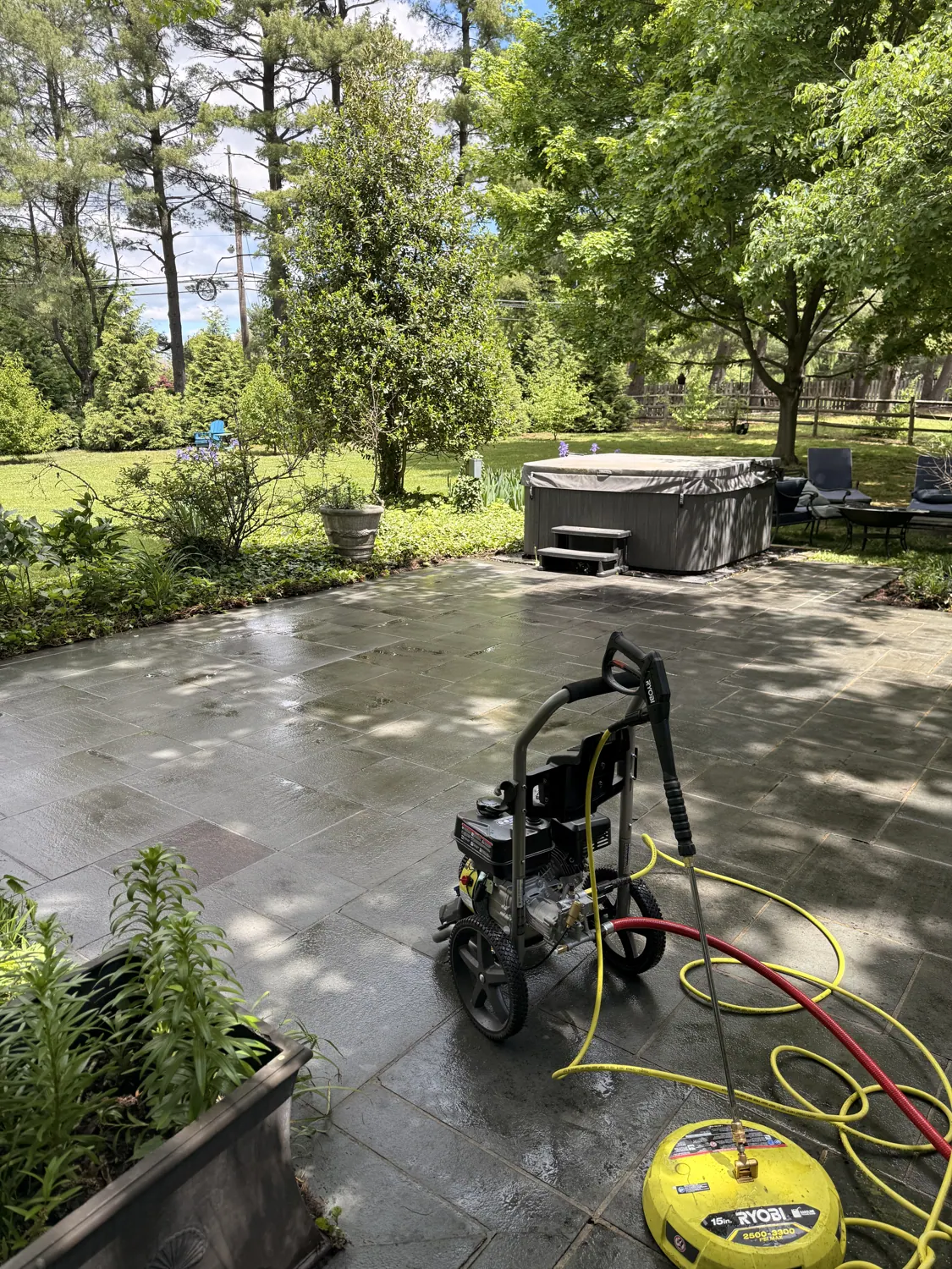 Wet patio during pressure washing